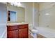 Clean bathroom with tub and wood vanity at 31225 Claridge Pl, Wesley Chapel, FL 33543