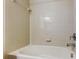Clean bathroom with shower/tub combo and neutral tile at 31225 Claridge Pl, Wesley Chapel, FL 33543