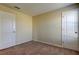 Empty bedroom with neutral walls, carpet, and two doors at 31225 Claridge Pl, Wesley Chapel, FL 33543