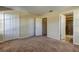 Bedroom with double doors to closets and bathroom at 31225 Claridge Pl, Wesley Chapel, FL 33543