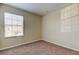 Empty bedroom with carpeted floor, window, and neutral walls at 31225 Claridge Pl, Wesley Chapel, FL 33543