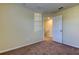 Bedroom with door to upper level and neutral walls at 31225 Claridge Pl, Wesley Chapel, FL 33543