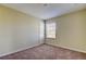 Simple bedroom with carpeted floor and a window with blinds at 31225 Claridge Pl, Wesley Chapel, FL 33543