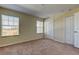 Bedroom with window, double closets, and carpet at 31225 Claridge Pl, Wesley Chapel, FL 33543