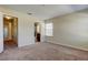 Bedroom with carpet, access to bathroom and hallway at 31225 Claridge Pl, Wesley Chapel, FL 33543