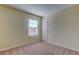 Simple bedroom with carpeted floor and a window with blinds at 31225 Claridge Pl, Wesley Chapel, FL 33543