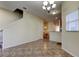 Dining area with tiled floors, chandelier, and kitchen access at 31225 Claridge Pl, Wesley Chapel, FL 33543