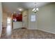 Bright dining room with tiled floors and kitchen view at 31225 Claridge Pl, Wesley Chapel, FL 33543