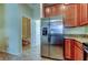 Stainless steel refrigerator and kitchen view at 31225 Claridge Pl, Wesley Chapel, FL 33543