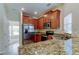 Modern kitchen with stainless steel appliances and granite counters at 31225 Claridge Pl, Wesley Chapel, FL 33543
