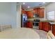 Kitchen with stainless steel appliances and wood cabinets at 31225 Claridge Pl, Wesley Chapel, FL 33543