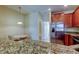 Kitchen boasts granite countertops and stainless steel appliances at 31225 Claridge Pl, Wesley Chapel, FL 33543