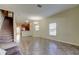 Spacious living area with tile floors and staircase at 31225 Claridge Pl, Wesley Chapel, FL 33543