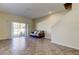 Spacious living room with tiled floors and access to backyard at 31225 Claridge Pl, Wesley Chapel, FL 33543