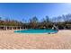 Community swimming pool with brick pavers and ample lounge space at 31225 Claridge Pl, Wesley Chapel, FL 33543