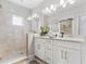 Modern bathroom with double vanity and large shower at 3132 Nautical S Pl, St Petersburg, FL 33712