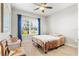 Bright bedroom with a double bed, ceiling fan, and window coverings at 3132 Nautical S Pl, St Petersburg, FL 33712