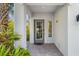 Inviting entryway with a gray door and brick walkway at 3132 Nautical S Pl, St Petersburg, FL 33712