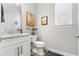 Clean half bathroom with granite countertop and modern fixtures at 3132 Nautical S Pl, St Petersburg, FL 33712