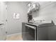 Laundry room with washer, dryer, and storage shelves at 3132 Nautical S Pl, St Petersburg, FL 33712