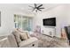 Relaxing living room with comfortable seating and access to a balcony at 3132 Nautical S Pl, St Petersburg, FL 33712