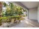 Private patio with lush landscaping and water views at 3132 Nautical S Pl, St Petersburg, FL 33712