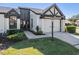 House entrance with walkway, landscaping, and a lamp post at 3490 Cedar Ln, Palm Harbor, FL 34684