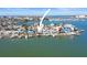 Aerial view of a waterfront home with boat dock and beautiful surroundings at 353 144Th Ave, Madeira Beach, FL 33708