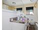 Bathroom with granite vanity, shower, and toilet at 353 144Th Ave, Madeira Beach, FL 33708