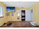 Bedroom with hardwood floors and large TV at 353 144Th Ave, Madeira Beach, FL 33708