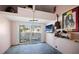 Bonus room with loft storage and sliding glass doors at 353 144Th Ave, Madeira Beach, FL 33708