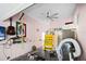 Garage with ceiling fan, workbench, and refrigerator at 353 144Th Ave, Madeira Beach, FL 33708