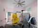 Garage with ceiling fan, workbench, and refrigerator at 353 144Th Ave, Madeira Beach, FL 33708