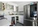 White kitchen cabinets, stainless steel appliances, and ample storage space at 353 144Th Ave, Madeira Beach, FL 33708