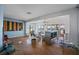 Living room with hardwood floors, water views, and access to a deck at 353 144Th Ave, Madeira Beach, FL 33708