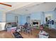 Living room with fireplace, hardwood floors, and access to other rooms at 353 144Th Ave, Madeira Beach, FL 33708