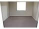 Spacious carpeted bedroom with large window and neutral walls at 4215 E Bay Dr # 1202C, Clearwater, FL 33764