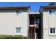 Two-story condo building with stairs and individual entrances at 4215 E Bay Dr # 1202C, Clearwater, FL 33764