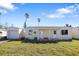 Single-story house with attached garage and covered porch at 503 140Th E Ave, Madeira Beach, FL 33708