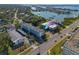 Aerial view showing condo building near waterfront, highlighting its convenient location at 55 Harbor View Ln # 301, Belleair Bluffs, FL 33770