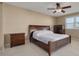 Spacious bedroom with a large bed and wood dresser at 55 Harbor View Ln # 301, Belleair Bluffs, FL 33770