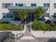 Condo building exterior featuring a modern design and lush landscaping at 55 Harbor View Ln # 301, Belleair Bluffs, FL 33770