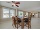 Open dining room features a wood table and views into the living area at 55 Harbor View Ln # 301, Belleair Bluffs, FL 33770