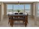 Bright dining room with water views and a wood table at 55 Harbor View Ln # 301, Belleair Bluffs, FL 33770
