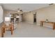Spacious living room with tile flooring, ceiling fan, and ample natural light at 55 Harbor View Ln # 301, Belleair Bluffs, FL 33770