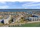 Aerial view of waterfront community with tennis courts, pool, and boat slips at 650 Island Way # 106, Clearwater Beach, FL 33767