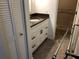 Bathroom vanity with a granite countertop and a shower/tub at 650 Island Way # 106, Clearwater Beach, FL 33767