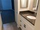 Bathroom with a granite countertop vanity, sink, and medicine cabinet at 650 Island Way # 106, Clearwater Beach, FL 33767