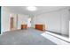 Bedroom with blue carpeting, neutral walls, and a slider to a balcony at 650 Island Way # 106, Clearwater Beach, FL 33767