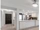 Modern kitchen with white cabinets, quartz countertops, and stainless steel appliances at 650 Island Way # 106, Clearwater Beach, FL 33767